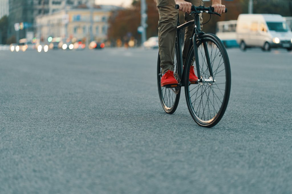 Closeup of casual man legs riding classic bike on city road | Muslim Cyclists | AICC